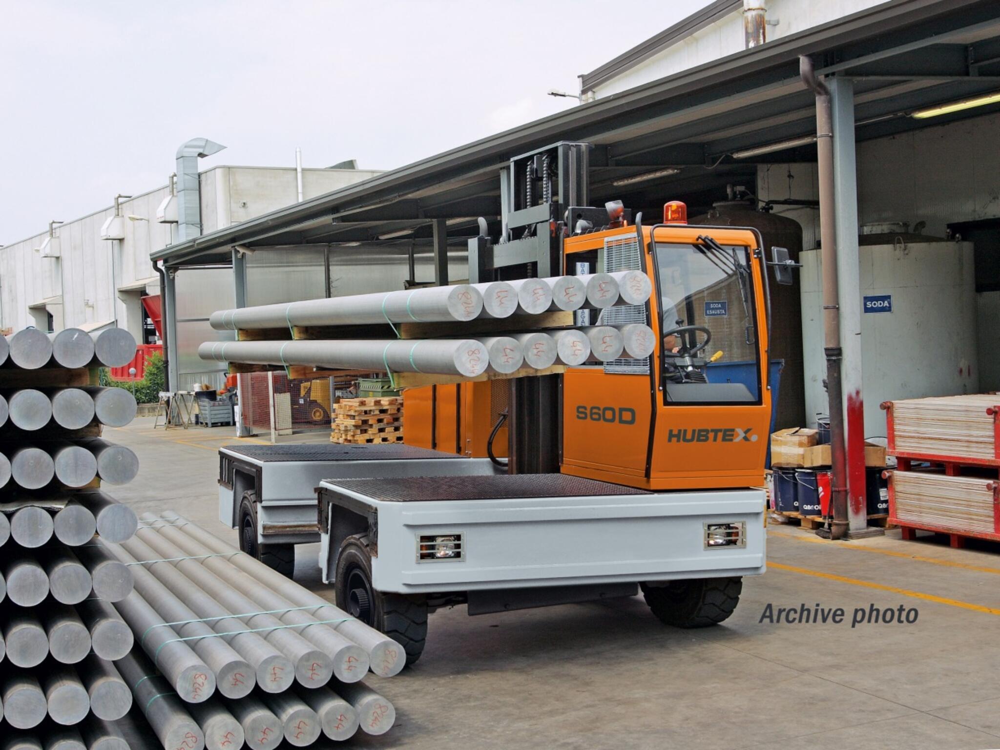 HUBTEX sideloading forklifts for handling long loads in the warehouse